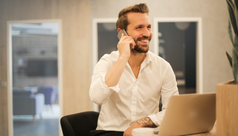 Happy employee on the phone