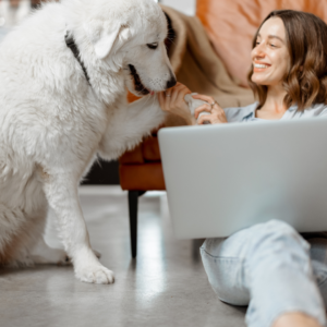 woman happy at home with her dog