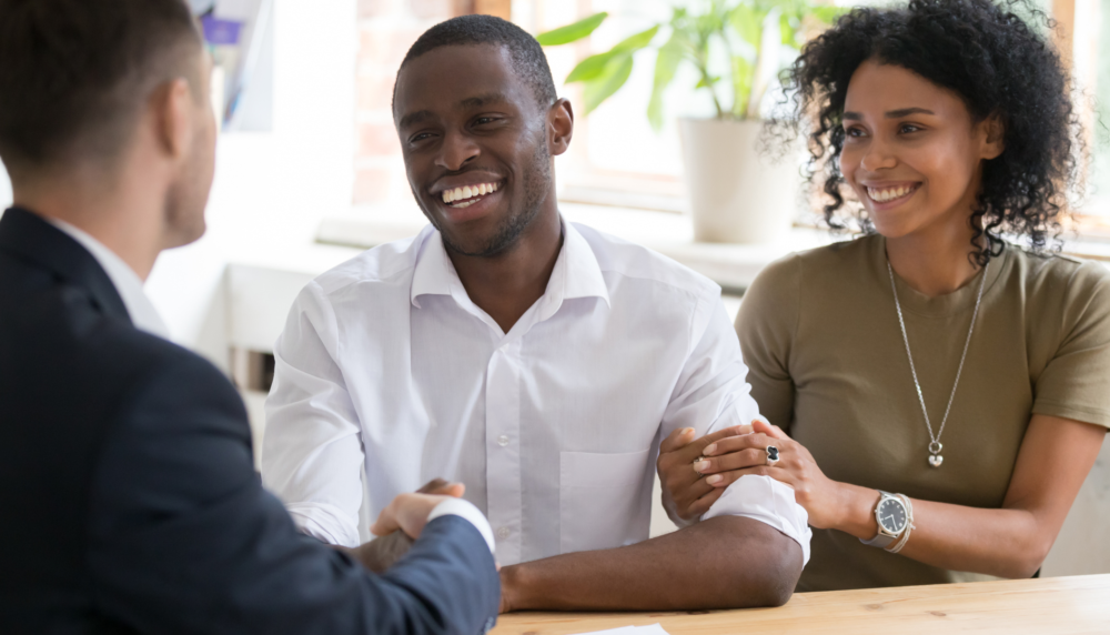 happy couple smiling at a meeting