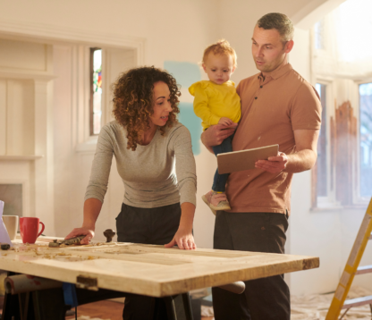 family doing home improvements looking at an ipad