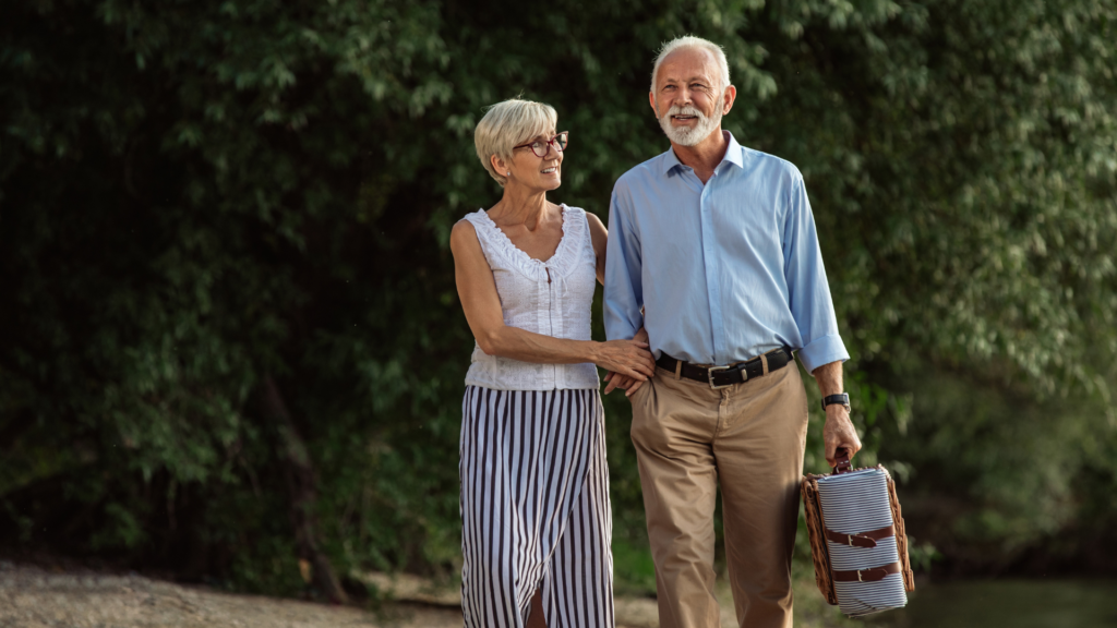 over 55s couple in retirement walking
