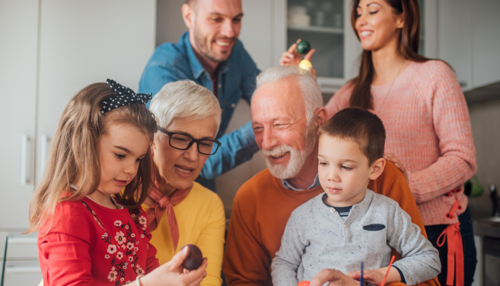 Older parent sharing a meaningful moment with children and grandchildren, symbolising the role of Potentially Exempt Transfers in thoughtful lifetime gifting