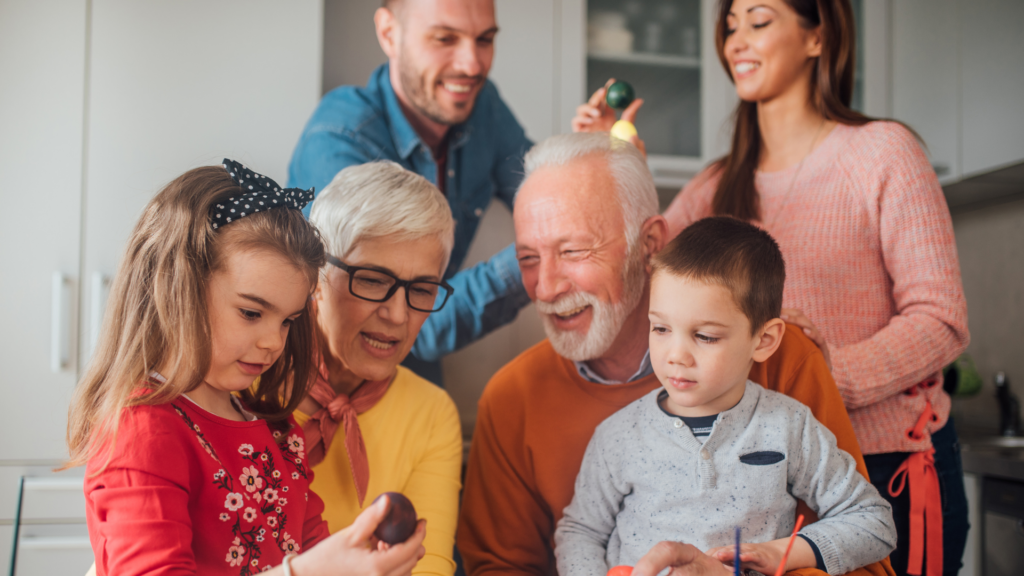 Older parent sharing a meaningful moment with children and grandchildren, symbolising the role of Potentially Exempt Transfers in thoughtful lifetime gifting