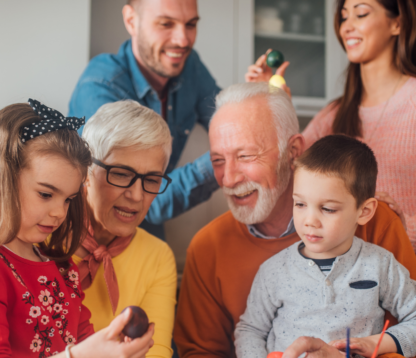 Older parent sharing a meaningful moment with children and grandchildren, symbolising the role of Potentially Exempt Transfers in thoughtful lifetime gifting