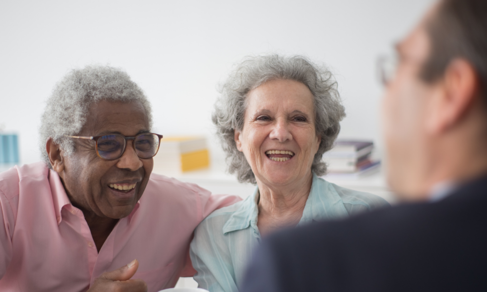 Couple discussing rio mortgage and other later life mortgage options with a specialist later life mortgage adviser