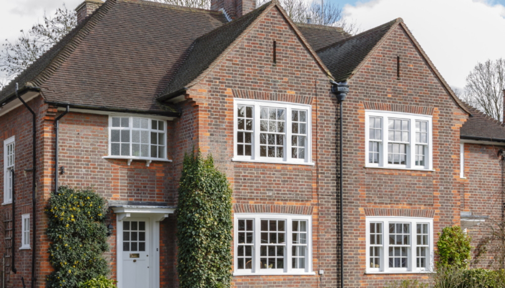 Traditional red-brick detached house in the UK, representing property wealth and inheritance tax considerations for homeowners.