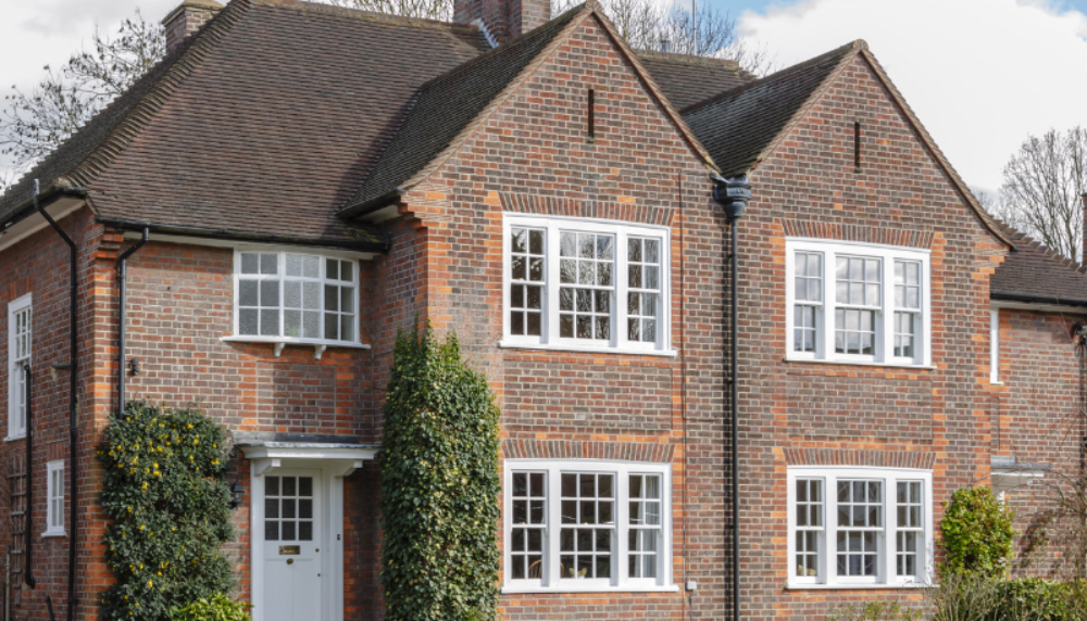 Traditional red-brick detached house in the UK, representing property wealth and inheritance tax considerations for homeowners.