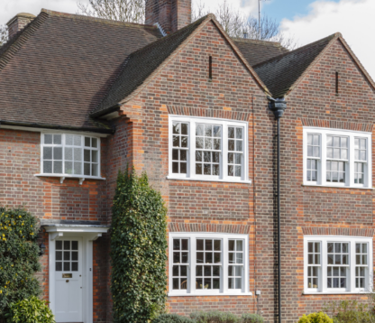 Traditional red-brick detached house in the UK, representing property wealth and inheritance tax considerations for homeowners.