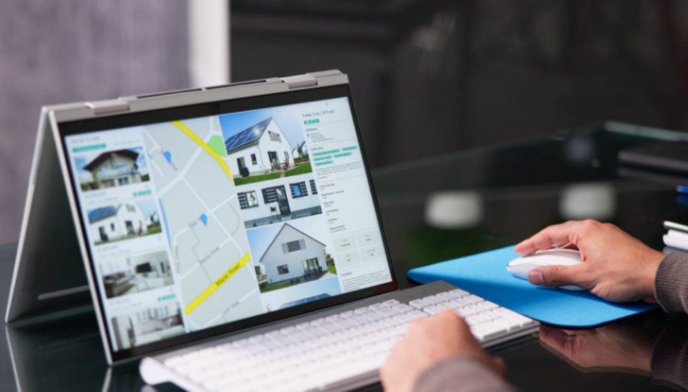 Landlord analysing property portfolio on laptop for strategic remortgaging and investment optimisation.